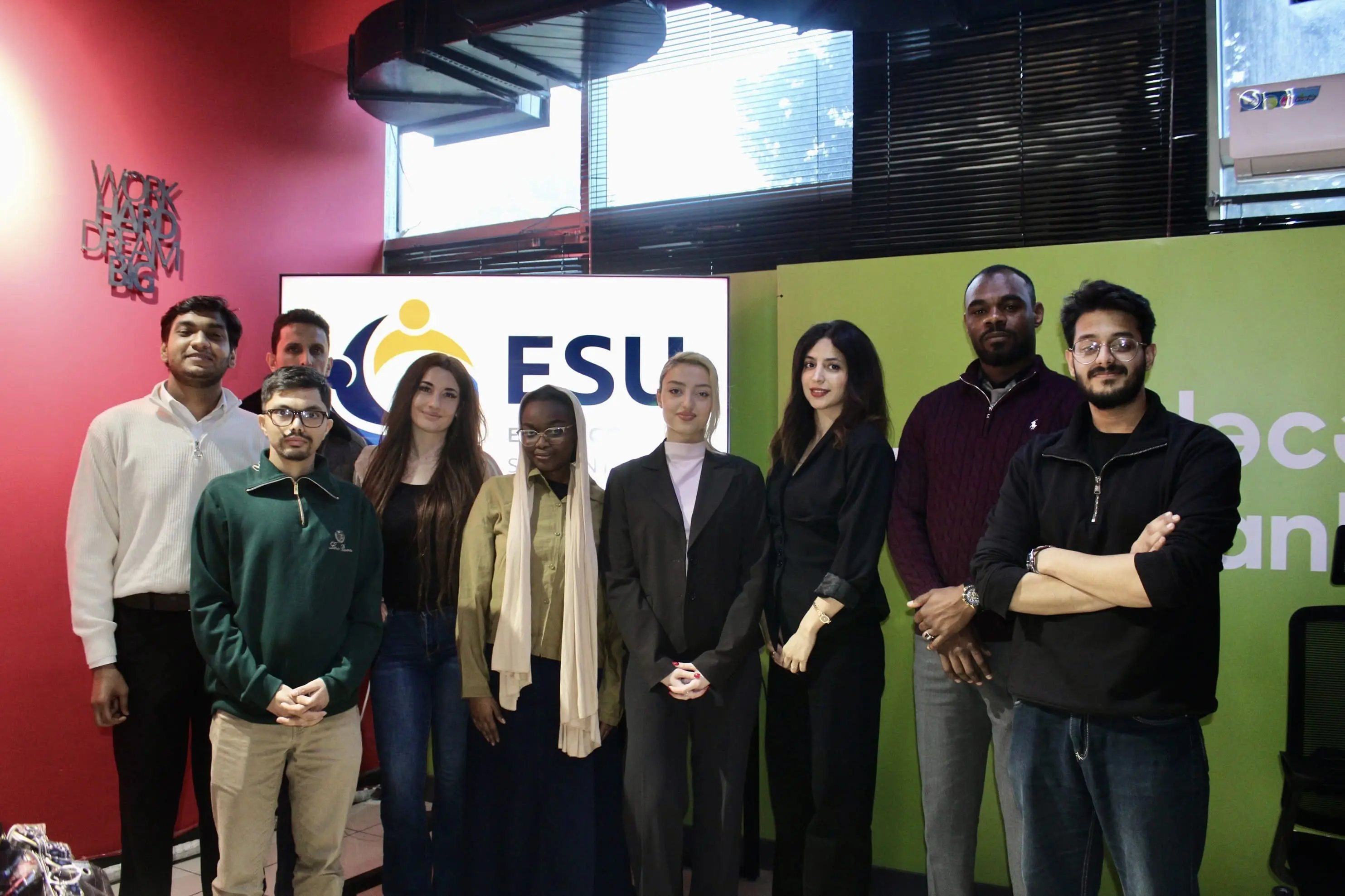 EtudyGo Student Leads standing together in front of the ESU Azerbaijan backdrop